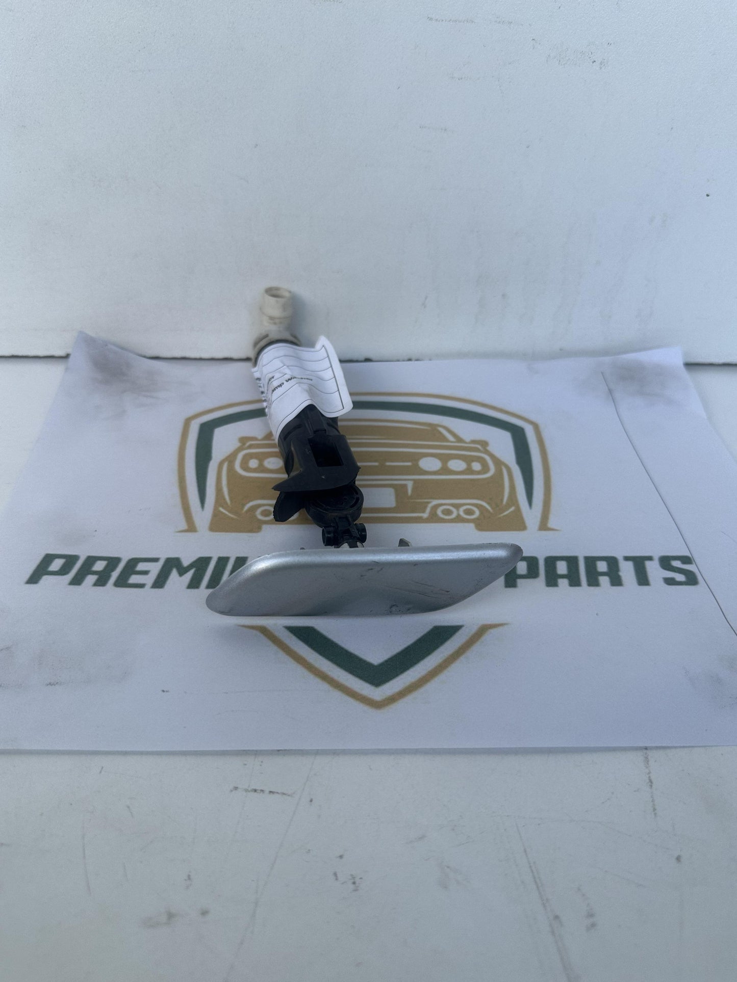 2009  J150 Left Headlight Washer Jet