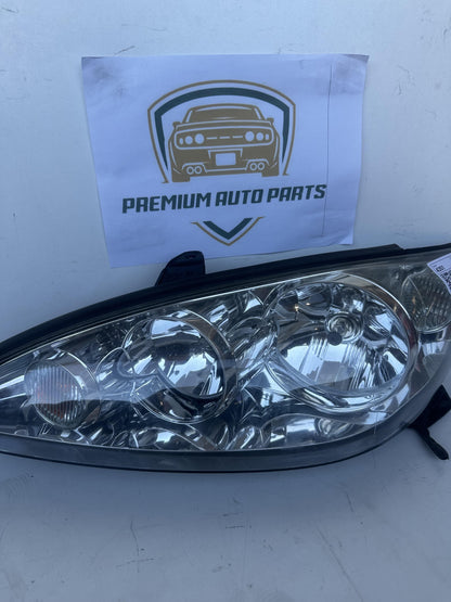 2004  V30 Left Headlight