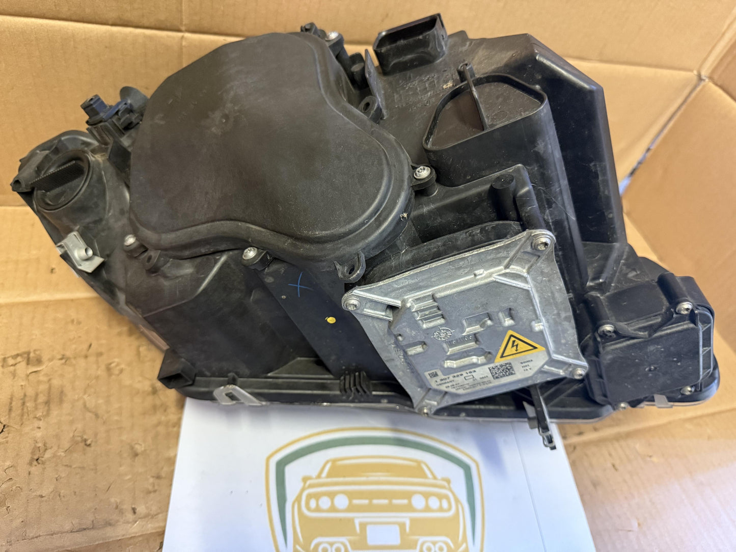 2009  E93 Left Headlight