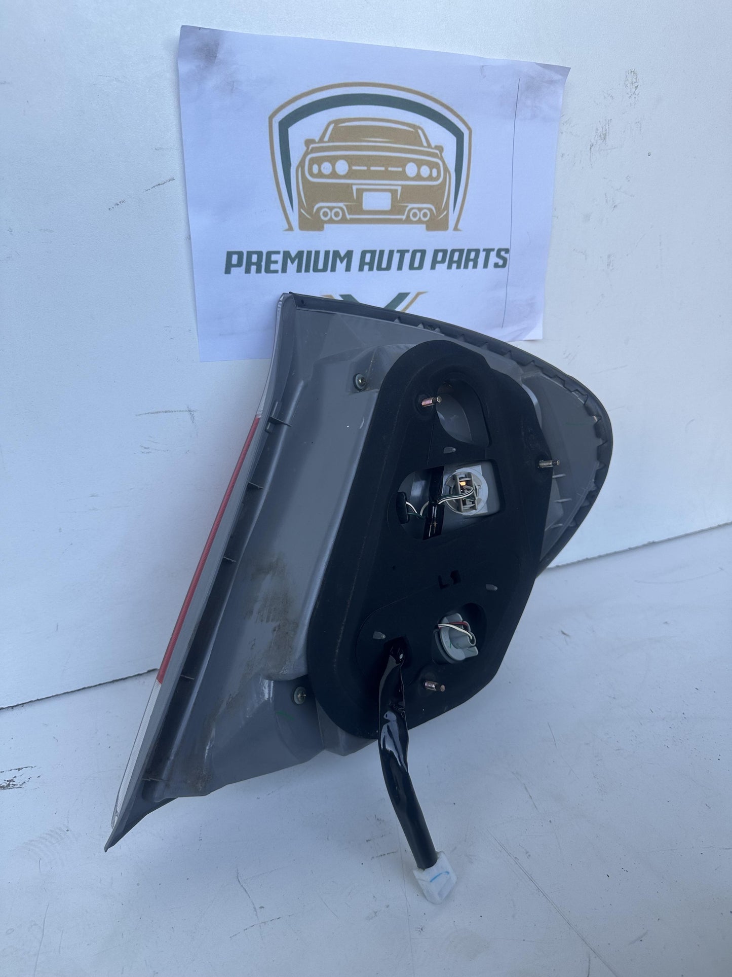 2004  V30 Left Taillight