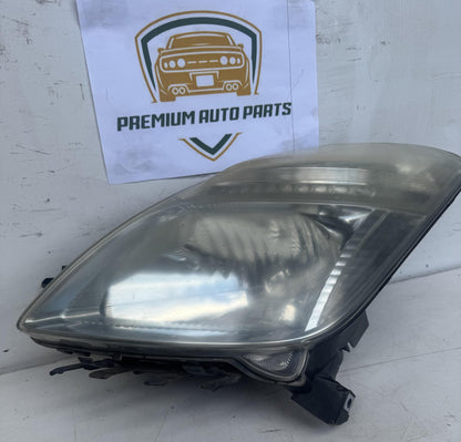 2006  W20 Left Headlight