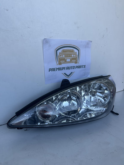 2004  V30 Left Headlight