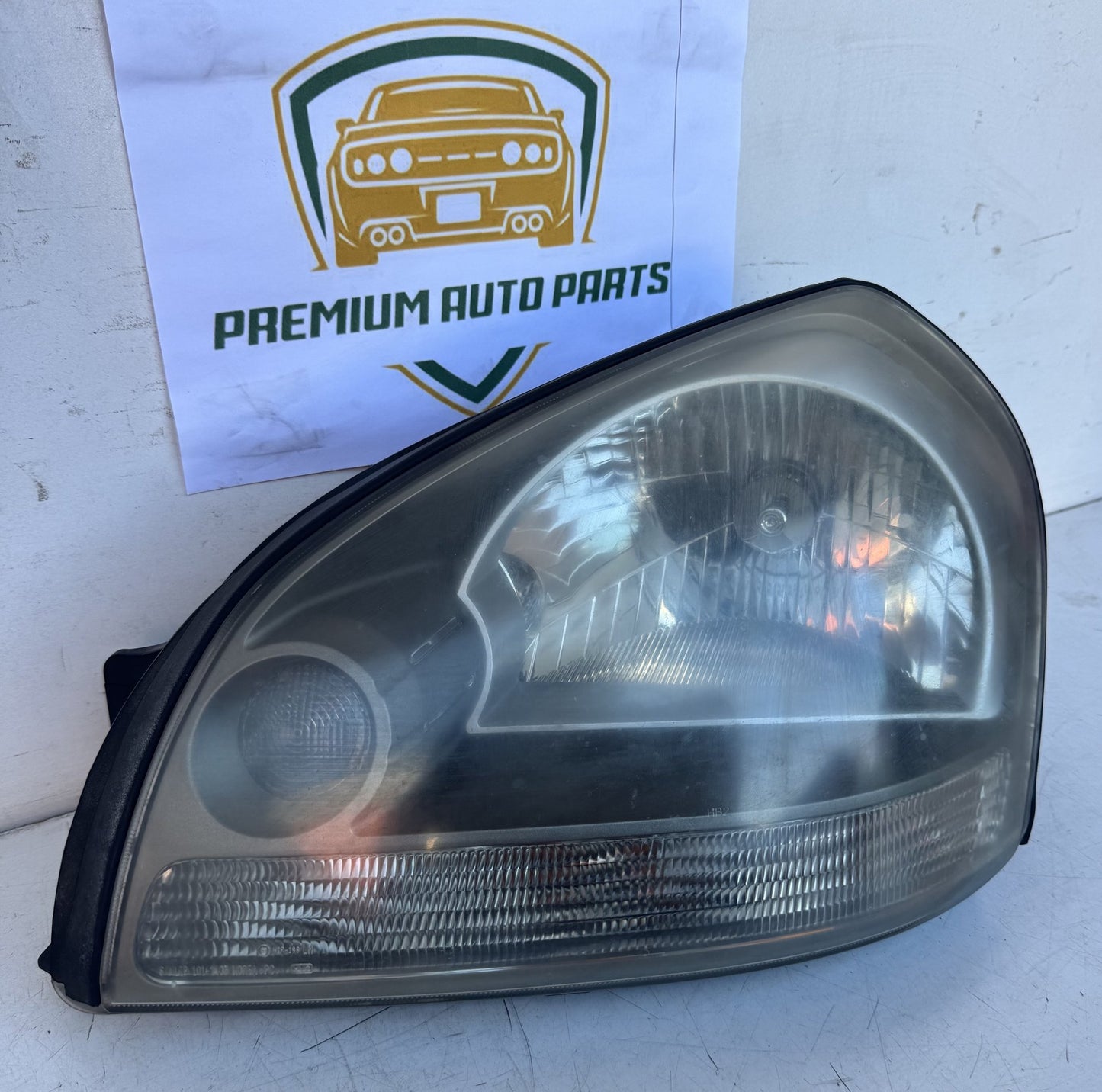 2009  JM Left Headlight