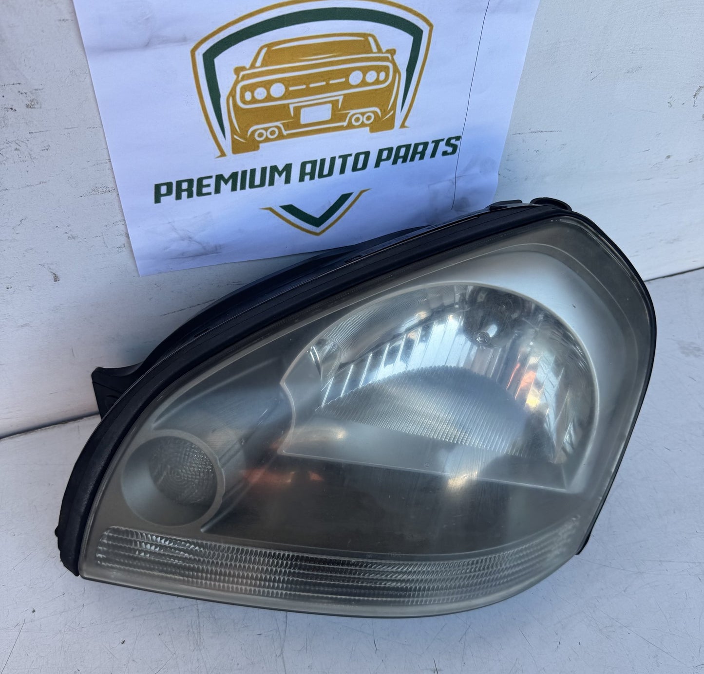 2009  JM Left Headlight