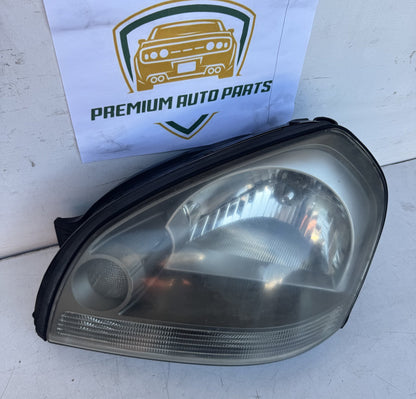 2009  JM Left Headlight